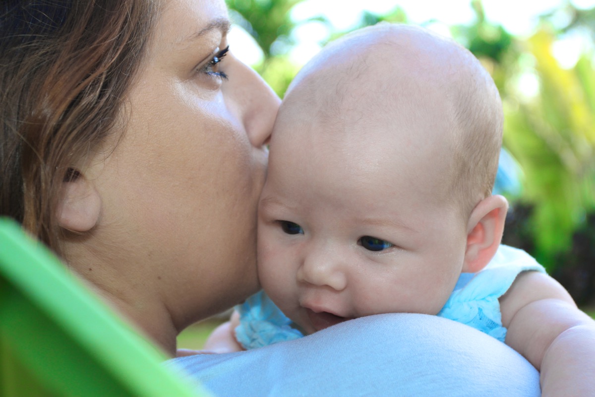 Parent cuddling baby