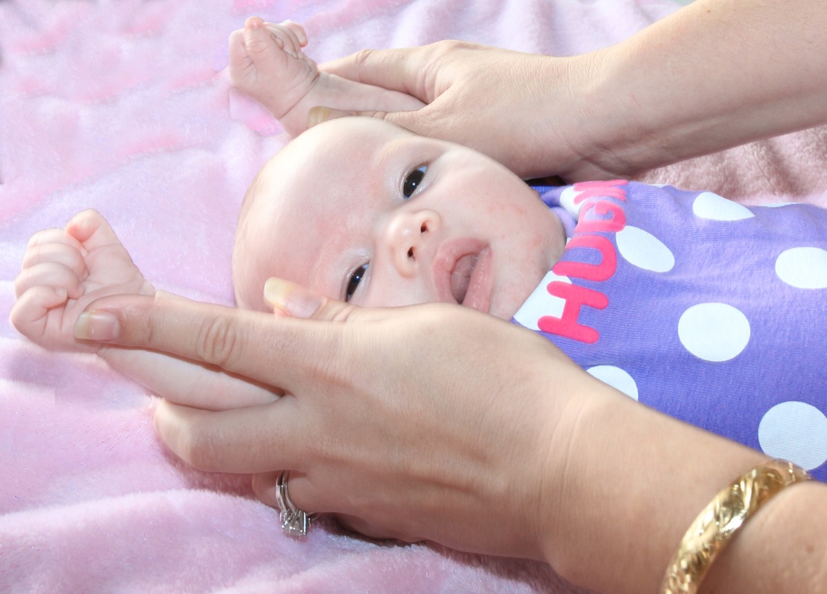 Baby stretching arms